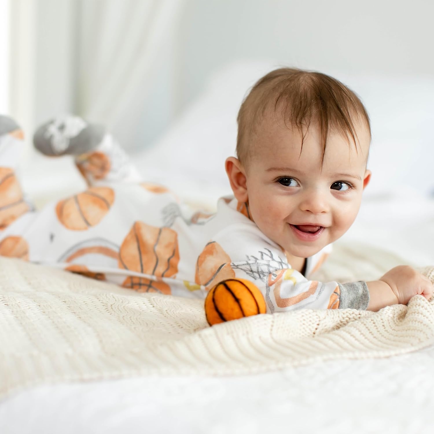 image:imageBurts Bees Baby Organic Cotton Sleep and Play Footed Pajamas for BoysBasketball