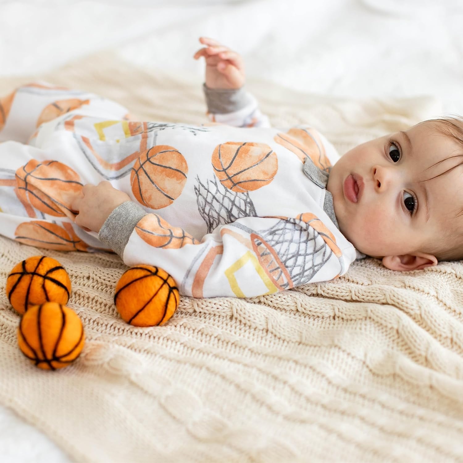 image:imageBurts Bees Baby Organic Cotton Sleep and Play Footed Pajamas for BoysBasketball